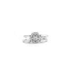 Silver ring with a diamond cluster on a white background