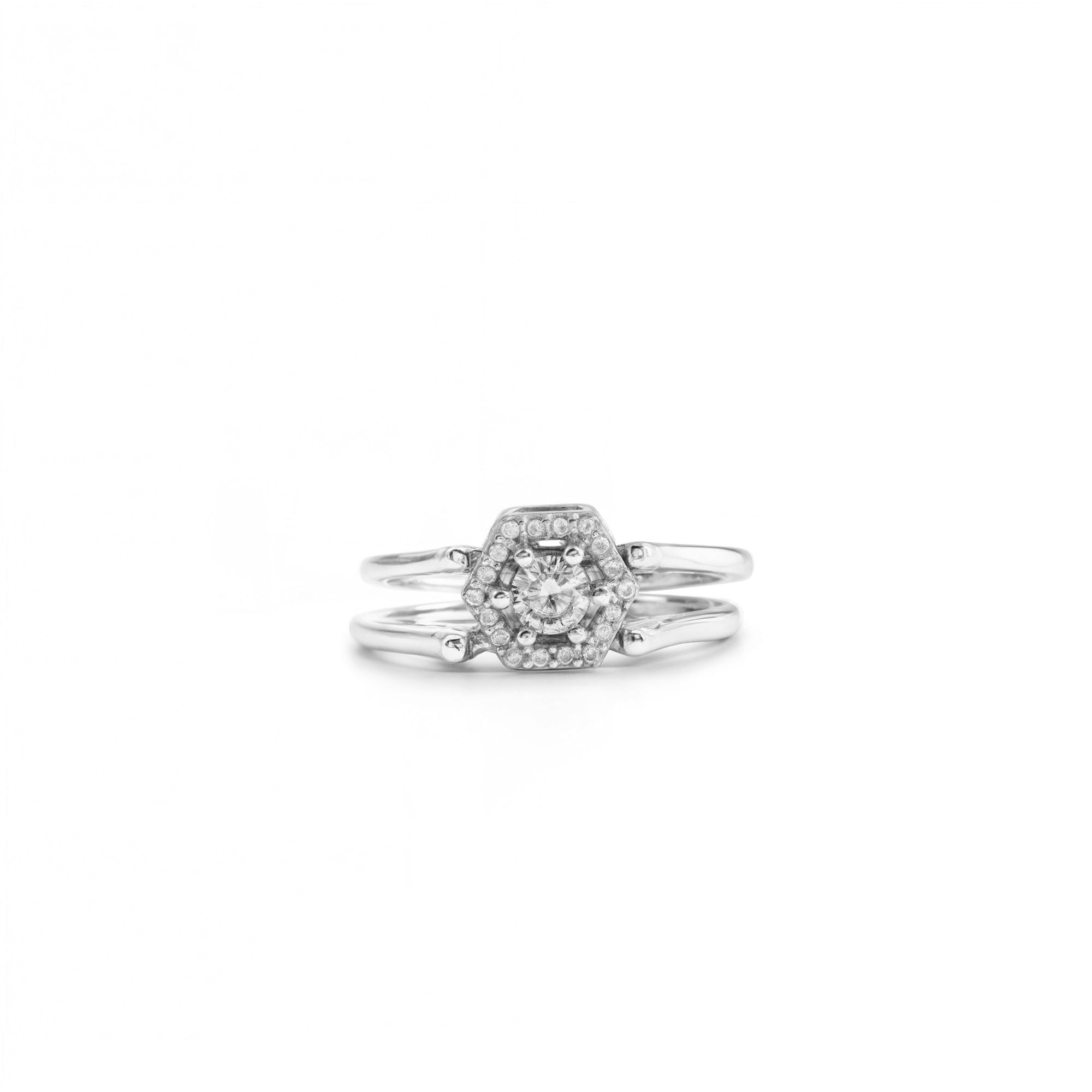 Silver ring with a diamond cluster on a white background