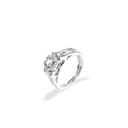 Silver ring with a central diamond and smaller diamonds on a white background