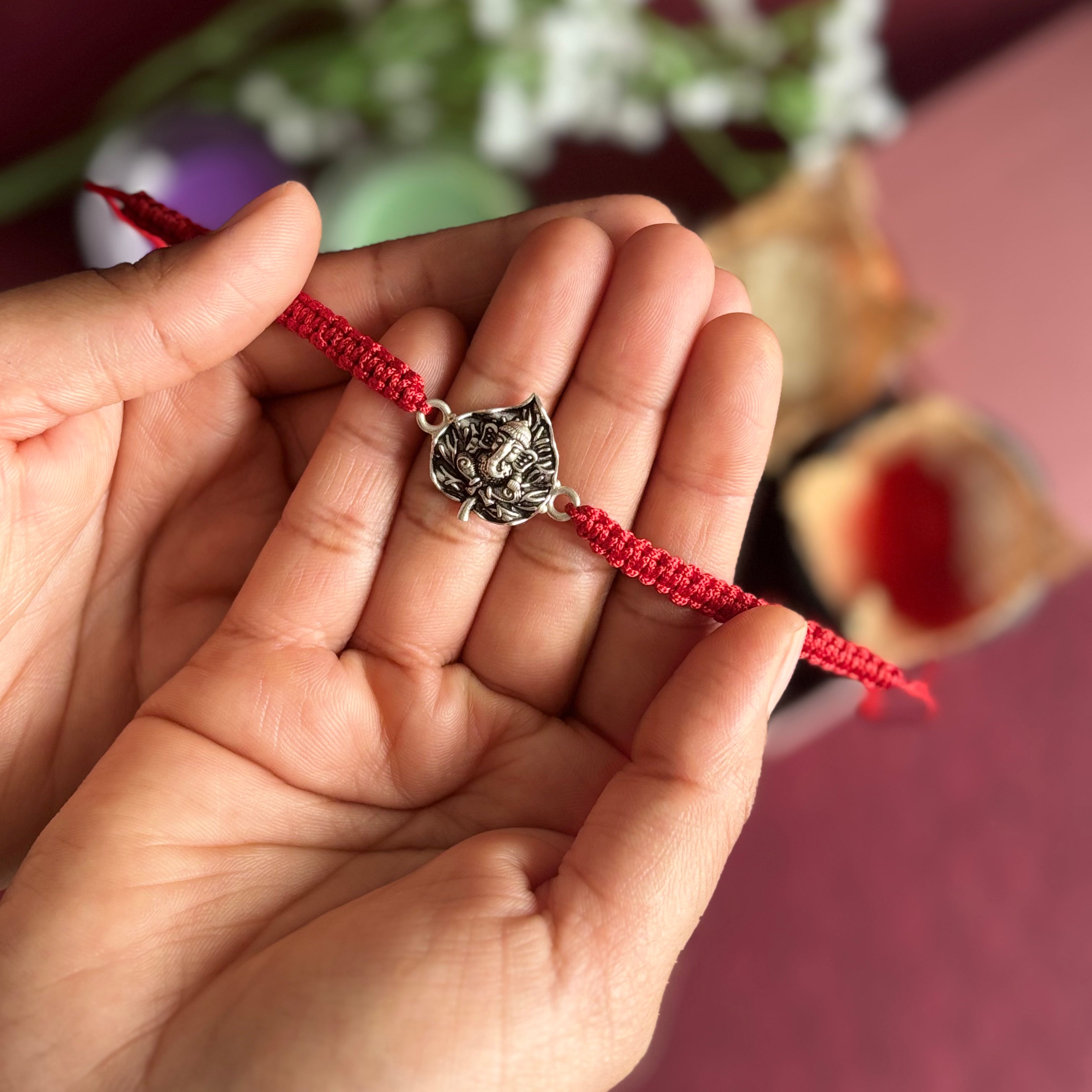 Divine Ganpati Rakhi in Silver
