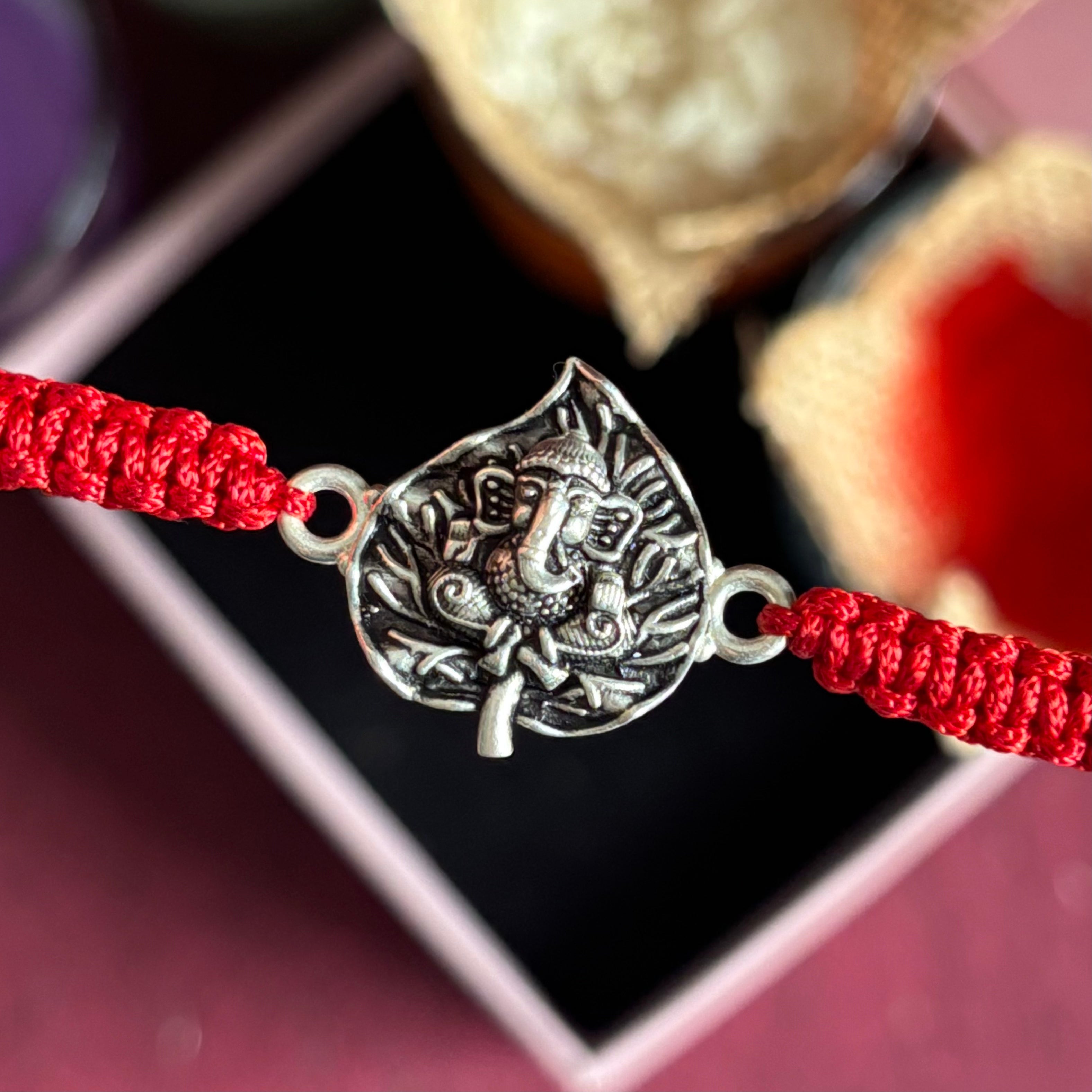 Divine Ganpati Rakhi in Silver